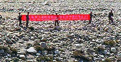 Chinese soldiers in areas facing Ladakh hold a banner reading, This is the Line of Actual Control. You are in Chinese territory.