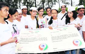 LONG WAIT Students from various educational institutions in Ambala waited for Union HRD Minister Kapil Sibal to sign a petition, vowing to spend nine per cent of the GDP for health and education