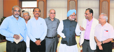 Prime Minister Manmohan Singh interacts with senior editors in New Delhi on Wednesday. Seen in the picture (third from left) is Raj Chengappa, Editor-in-Chief of The Tribune group of publications. 
