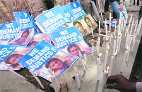 People organise a candlelight vigil in protest against the acquittal of actress Maria Susairaj in TV executive Neeraj Grover murder case, in Mumbai on Sunday