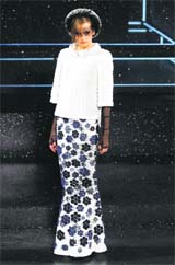 Flower power: A model presents a creation by German designer Karl Lagerfeld for French fashion house Chanel as part of his Haute Couture Fall-Winter 2011/2012 fashion show in Paris.