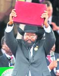 President  of the Rebublic of South Sudan Salva Kiir shows the newly signed constitution to people