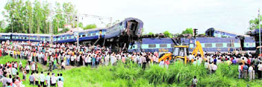 Mangled carriages at the site of the train accident near Malwa station.
