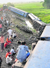 Rescue personnel at the accident site, where the Guwahati-Puri Express derailed. 