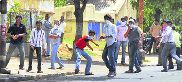Pro-Telangana students pelt the police with stones in Hyderabad on Monday during their Chalo Raj Bhawan agitation demanding the introduction of Telangana Bill in Parliament