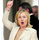 US Secretary of State Hillary Clinton gestures as she shows her support for her countrys football team that is playing the World Cup final against Japan. She was leaving after meeting Greek Foreign Minister Stavros Lambrinidis in Athens on Sunday.