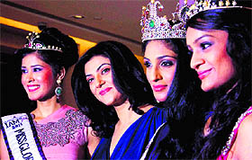 Bollywood actress Sushmita Sen poses for a group photo with winners (R-L) Vasuki Sunkavalli, Parul Duggal and Tanvi Singla during the I Am She national beauty pageant grand finale in Mumbairecently.