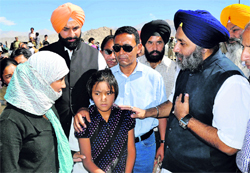 Deputy CM Sukhbir Singh Badal assures Stanzin Dolma, mother of Skalzang (in centre) of all help