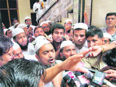 Darul Uloom vice-chancellor Maulana Ghulam Rasool Vastanvi speaks to the media after his sacking orders were announced.