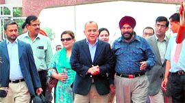 Pakistan Foreign Secretary Salman Bashir (fourth from left) crosses over to India at the Attari checkpost on Monday.