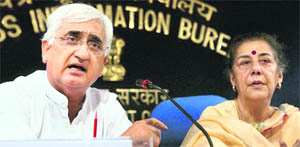 Union Law Minister Salman Khurshid and Information & Broadcasting Minister Ambika Soni after a Cabinet meeting in New Delhi 