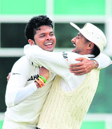 S Sreesanth (L) celebrates with Harbhajan Singh after dismissing Matt Prior during the first day of the second Test at Trent Bridge 