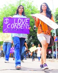 Participants carry placards during the Slut Walk in New Delhi