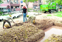 A large pit dug up in a park in Sector 40-C, Chandigarh, poses a danger to area residents, especially children