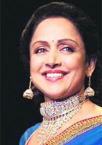 Dream girl: Bollywood actor Hema Malini walks the ramp during India International Jewellery Week 2011 in Mumbai on Monday. PTI Photo