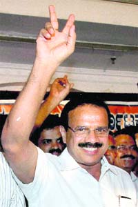 CLOSE SHAVE: Sadananda Gowda flashes a victory sign after being announced the new Karnataka Chief Minister in Bangalore on Wednesday