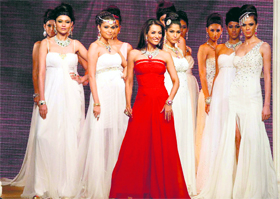 Bollywood actor Malaika Arora Khan walks the ramp during the second edition of Indian International Jewellery Week -2011 in Mumbai.