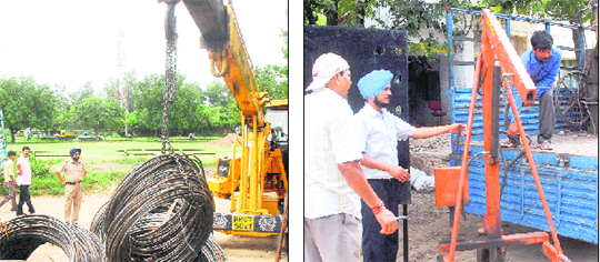 Employees of the municipal corporation’s enforcement wing remove encroachments from Industrial Area, Phase II, Chandigarh, on Monday.