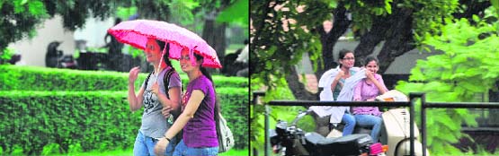 Students enjoy rain in Ludhiana on Monday. The showers brought down temperature in the city much to the relief of the residents