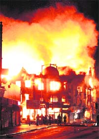 A property on fire near Reeves Corner in Croydon, south London, on Tuesday