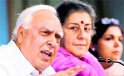 Union Ministers Kapil Sibal and Ambika Soni at a press conference in New Delhi.