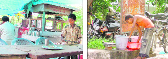 A child clears a table while another (right) cleans utensils in the mini secretariat in Ludhiana.