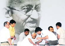 Anna Hazare with civil society members Kiran Bedi and Prashant Bhushan at the Ramlila Maidan. 