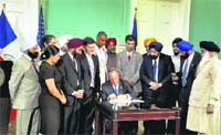 New York city Mayor Michael Bloomberg signing the Workplace Religious Freedom Bill into law in New York