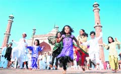 Childern in an upbeat mood at the Jama Masjid mosque after offering Eid-ul-Fitr prayers in New Delhi