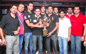 Game for it: CCL organisers and team captains posing with the trophy