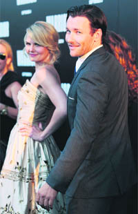 Actors Joel Edgerton (R) and Jennifer Morrison arrive at the film premiere of Warrior in Hollywood, California