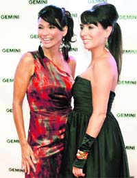Two to tango: Actresses Michelle Thrush (L) and Carmen Moore from the TV series Blackstone pose on the red carpet at the 26th Gemini Awards in Toronto