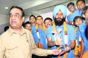 Sports Minister Ajay Maken with Indian hockey team captain Rajpal Singh in New Delhi on Tuesday
