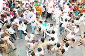 Supporters of Gujarat Chief Minister and police scuffle as large crowds tried to greet Modi on the second day of his fast in Ahmedabad on Sunday