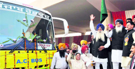A file photo of Parkash Singh Badal flagging off an AC coach at a function.
