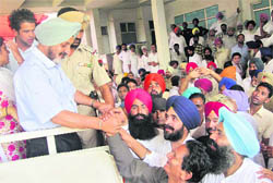 Former DGP, Punjab, PS Gill shakes hands with people and seeks their support in Moga. 