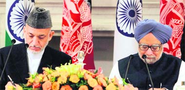 Afghan President Hamid Karzai and Prime Minister Manmohan Singh sign the landmark pact in New Delhi. Karzai began his two-day visit to India, his second this year, on Tuesday.