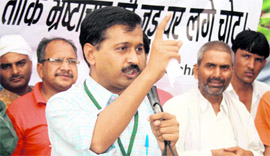 Arvind Kejriwal addresses a meeting at Nalwa village near Hisar on Sunday.