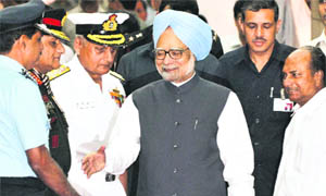 Prime Minister Manmohan Singh meets the three Services chiefs at the commanders conference in New Delhi