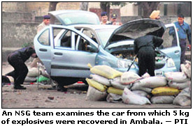 An NSG team examines the car from which 5 kg of explosives were recovered in Ambala.  PTI