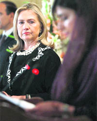 US Secretary of State Hillary Clinton (L) listens to Pakistan's Foreign Minister Hina Rabbani Khar during a joint press conference in Islamabad on Friday. 