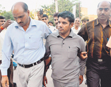 Shahbuddin being produced in a court after he surrendered to the CBI in Jodhpur on Saturday. 