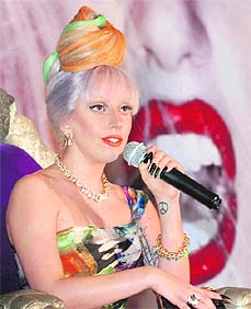 International pop diva Lady Gaga met the Press in New Delhi on Friday ahead of her Sunday concert. She wore a gown by Indian-American designer Naeem Khan topped off with a bouffant hairstyle in the colours of the Indian flag.