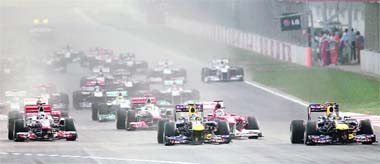 EARLY ADVANTAGE: Sebastian Vettel of Germany (R) leads the race at the start of the Indian Grand Prix in Greater Noida on Sunday