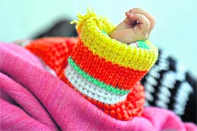 A newly born child lies in the ICU of a hospital in Srinagar on Sunday