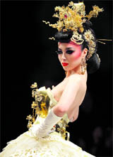 A model presents a creation by designer Tsai Meiyue's Spring/Summer 2012 wedding dress collection during China Fashion Week in Beijing