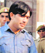 A convict in the case being taken to a jail in New Delhi. 