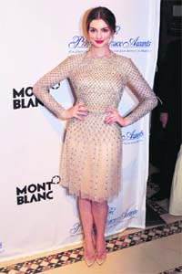 Crystal clear: Actress Anne Hathaway poses after presenting an award during the Princess Grace Awards Gala in New York. — Reuters