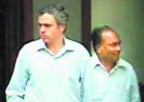 A TV grab of J&K Chief Minister Omar Abdullah with Defence Minister AK Antony in New Delhi on Sunday