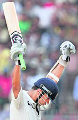 Rahul Dravid celebrates his 36th Test hundred on Day 1 of the second Test against the Windies in Kolkata on Monday